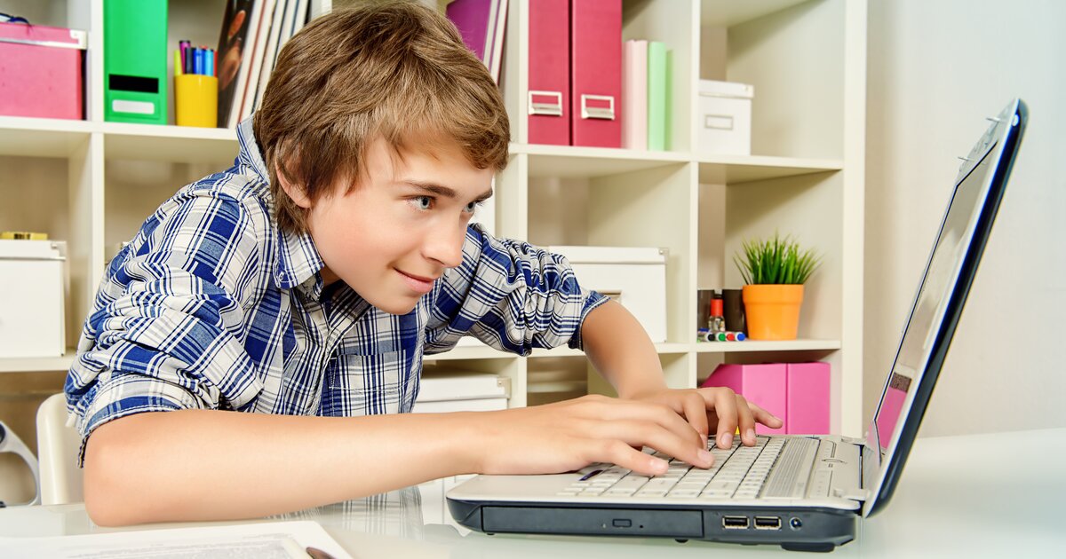 He is playing a computer. Школьник планирует свой день фото и картинки. Teenager is playing on Computer.